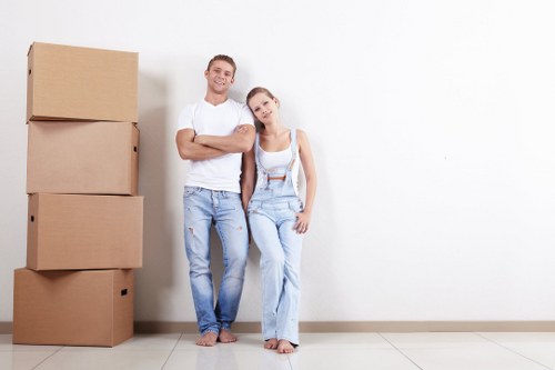 Professional removals team handling boxes during a London move