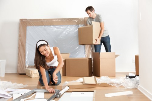 Moving team preparing belongings with safety equipment during a London removal