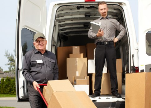 Professional furniture removals team preparing items for transport in London