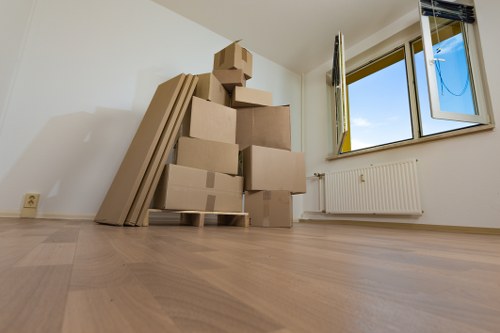 Office relocation with movers transporting equipment in London