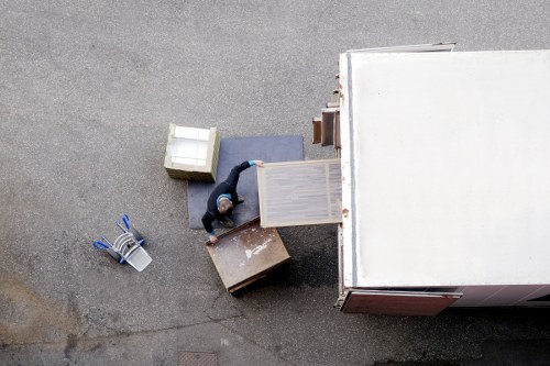 Professional packers handling household items during a booking process