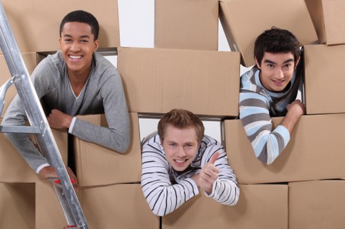 Staff handling boxes safely during a moving operation