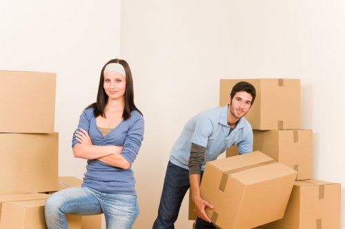 Employee following safe manual handling practices with equipment