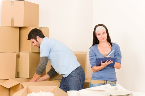 Professionals packing office equipment for a London commercial relocation